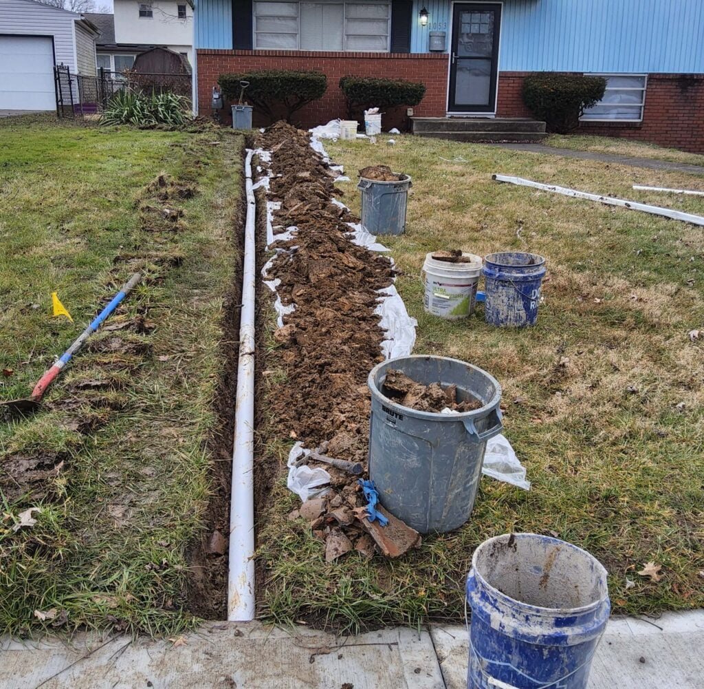yard with drainage in ditch before grass covers it.